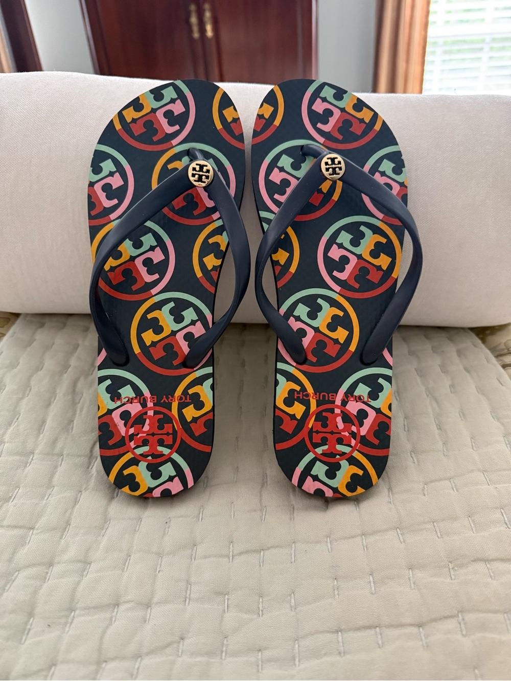 New Tory Burch Navy Strap Flip Flops with Multicolor Logo Print navy base color. - Picture 2 of 10
